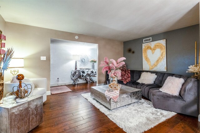 living room featuring dark wood-type flooring