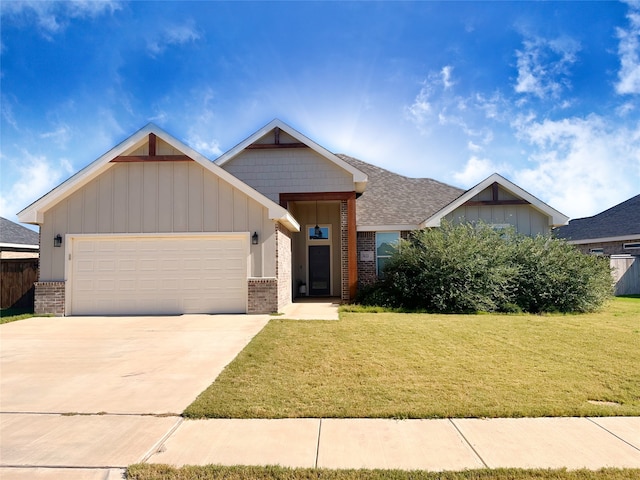 view of front of property with a garage and a front yard