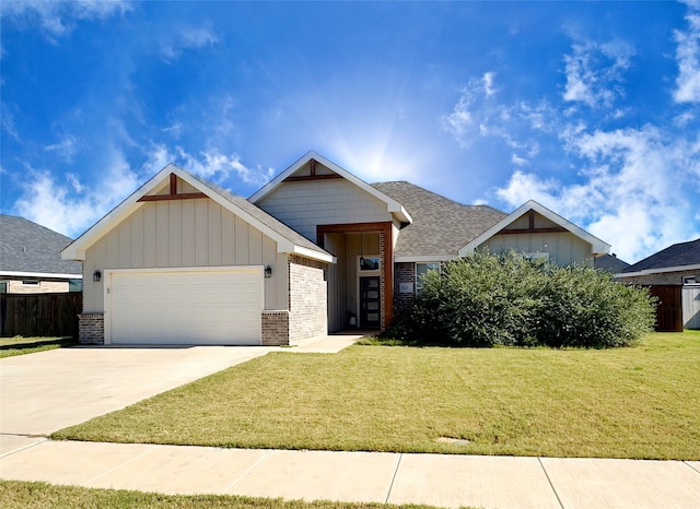 view of front of home featuring a garage and a front lawn