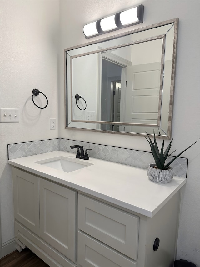 bathroom featuring hardwood / wood-style floors and vanity