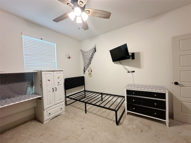 bedroom featuring light carpet and ceiling fan