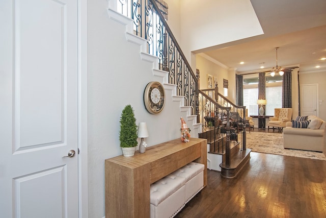 interior space with hardwood / wood-style flooring and crown molding