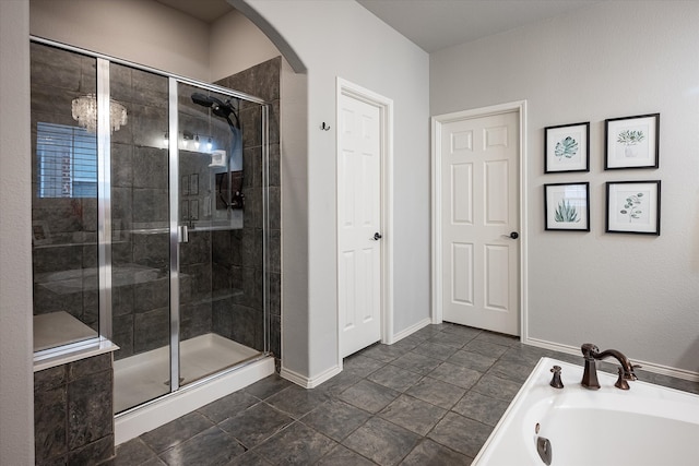 bathroom featuring shower with separate bathtub and tile patterned floors