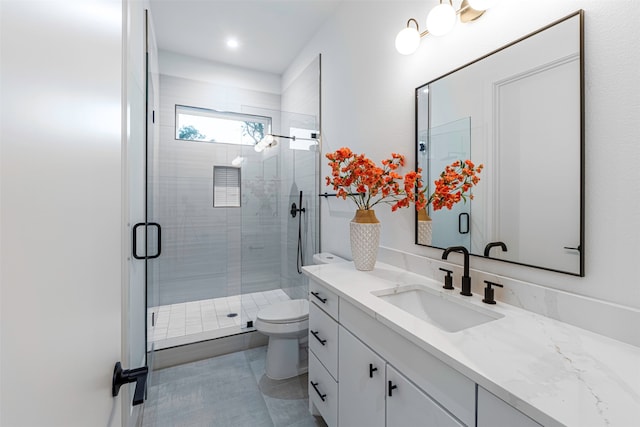 bathroom with tile patterned flooring, vanity, toilet, and an enclosed shower