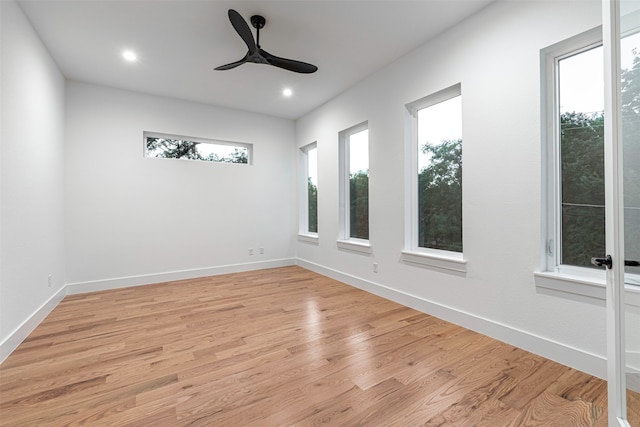 empty room featuring light wood-type flooring and ceiling fan