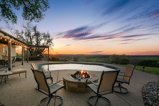 patio terrace at dusk with a fire pit