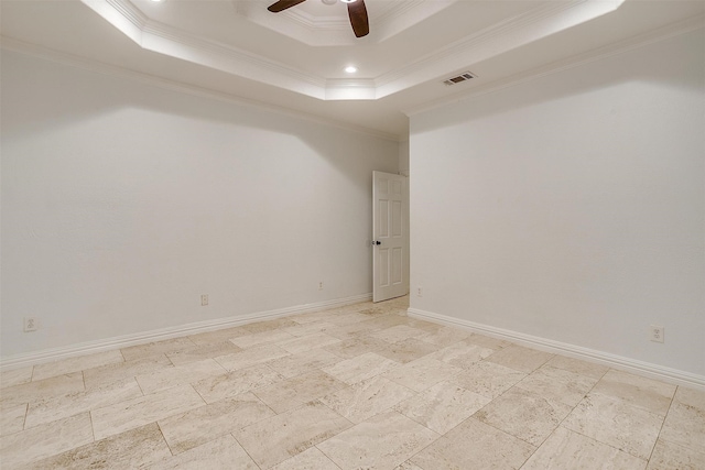 unfurnished room featuring ceiling fan, a tray ceiling, and ornamental molding