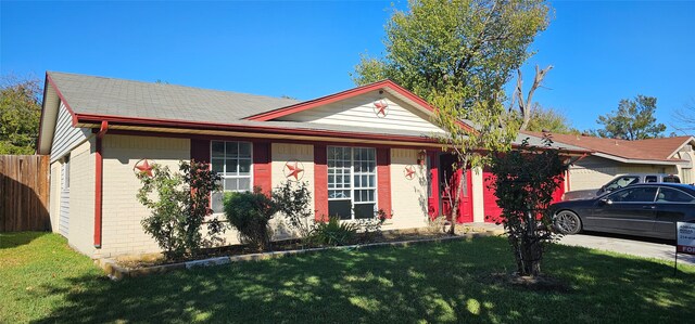 ranch-style home with a front lawn