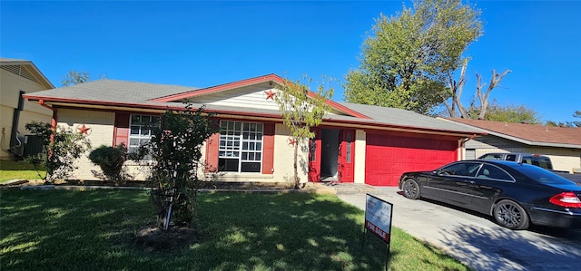 single story home featuring a garage and a front lawn