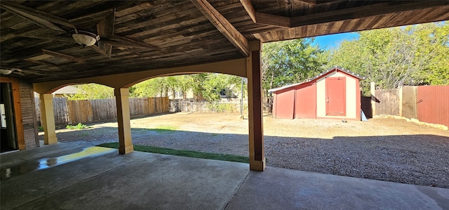 view of patio featuring a storage unit and ceiling fan