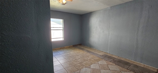 empty room featuring light tile patterned floors