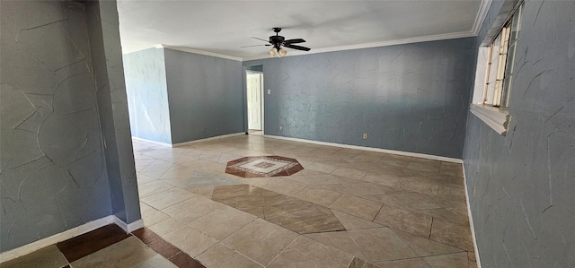 spare room with ceiling fan and crown molding