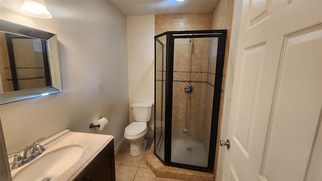 bathroom with vanity, toilet, an enclosed shower, and tile patterned flooring