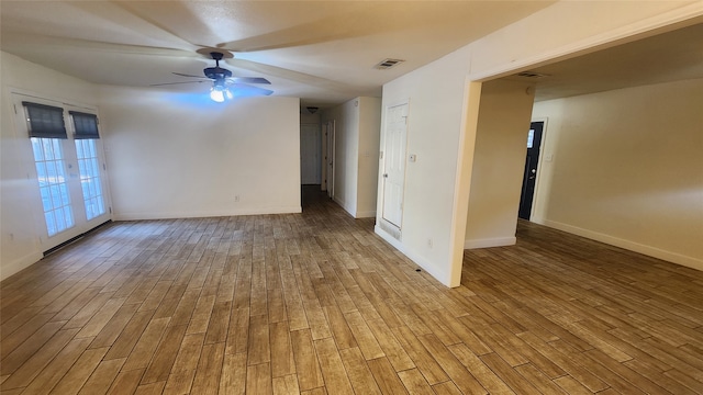 empty room with ceiling fan and light wood-type flooring