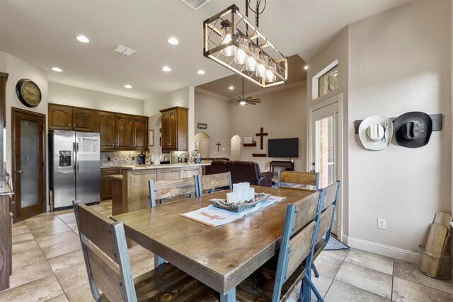 dining room featuring a wealth of natural light and light tile patterned flooring