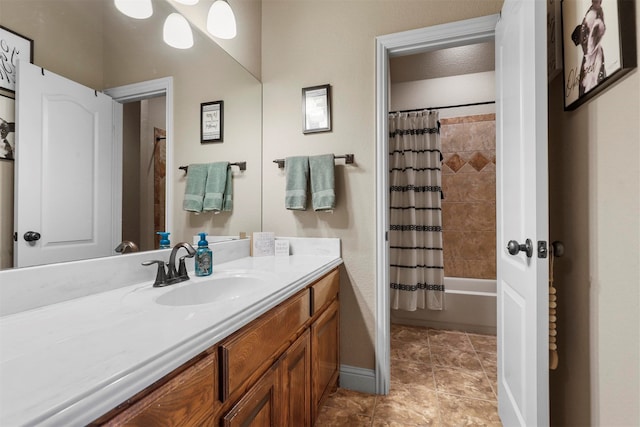 bathroom with tile patterned floors, vanity, and shower / bathtub combination with curtain