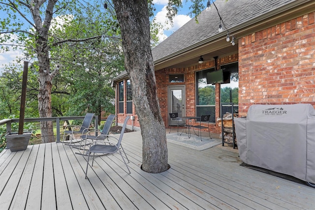 wooden deck with area for grilling