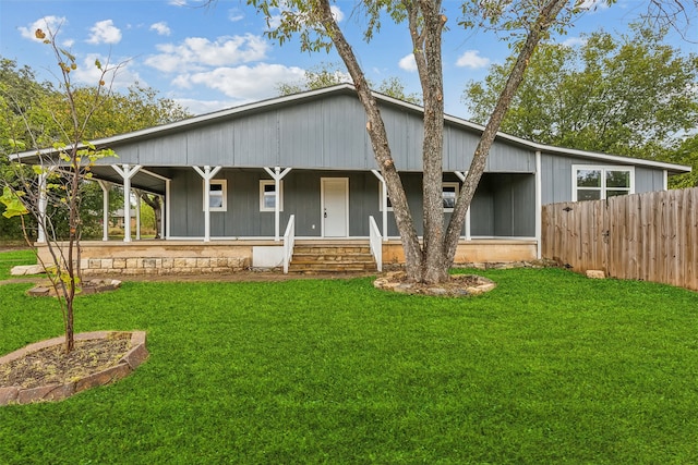 view of front of house featuring a front yard and covered porch