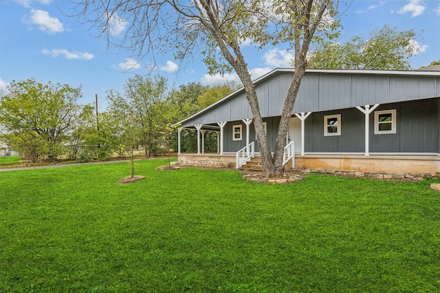 exterior space featuring a front yard and covered porch