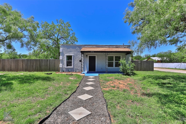 view of front of home with a front lawn