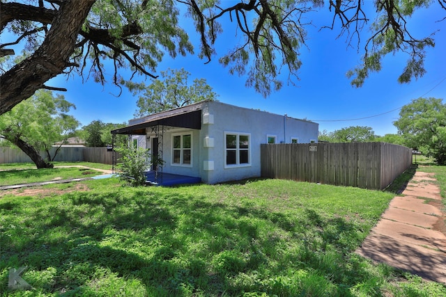 view of home's exterior with a yard