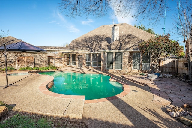 view of swimming pool featuring a patio area