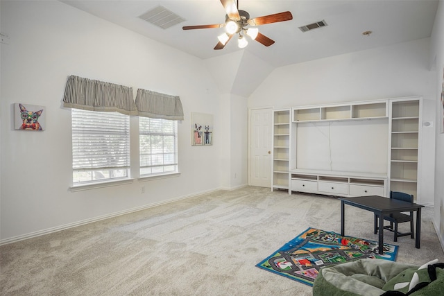 carpeted living room featuring ceiling fan and lofted ceiling