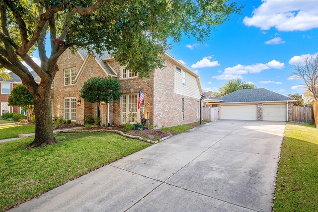 view of front of house featuring a front yard and a garage