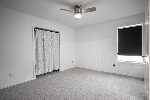 carpeted empty room with ceiling fan