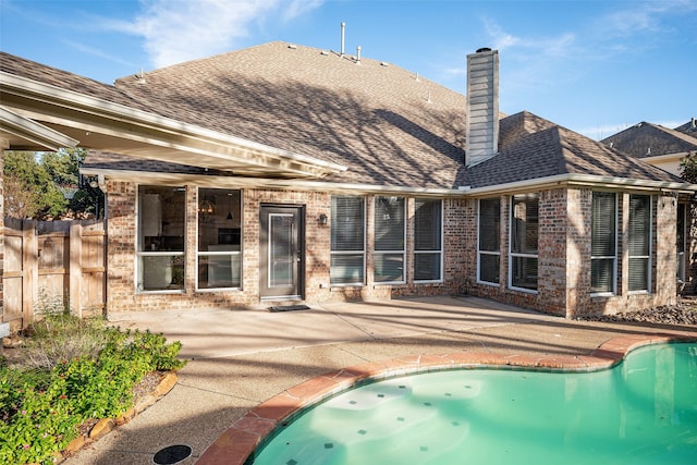 rear view of property featuring a patio area