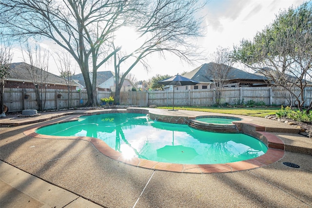 view of pool featuring an in ground hot tub and a patio area