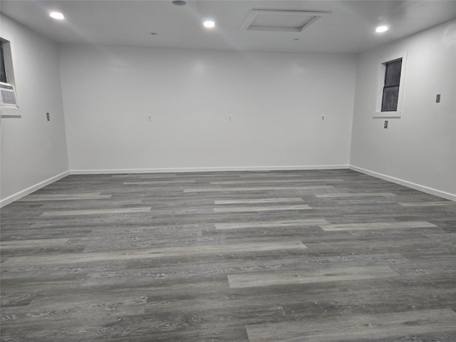 empty room with dark hardwood / wood-style flooring