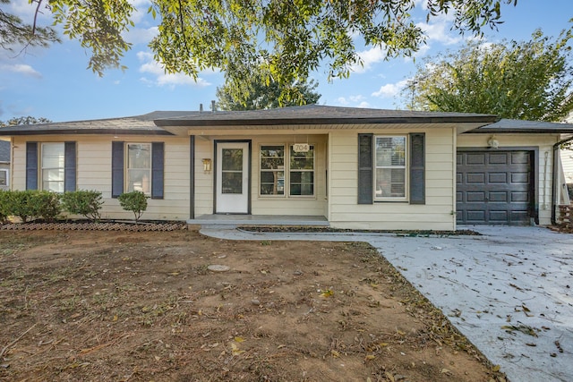 single story home with a garage and a porch