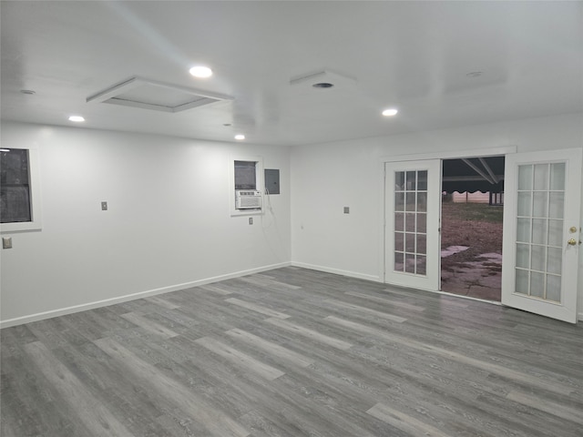 spare room featuring french doors and wood-type flooring