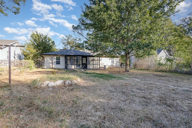 view of yard featuring a sunroom