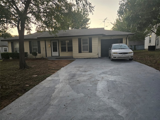 ranch-style house with a garage and a porch