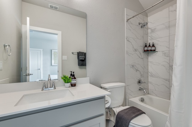 full bathroom with vanity, shower / bath combo with shower curtain, and toilet