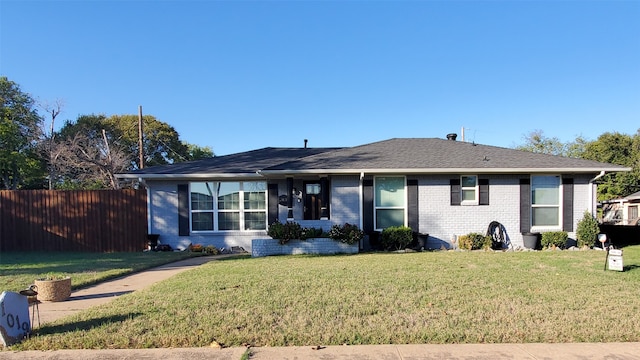 single story home with a front lawn