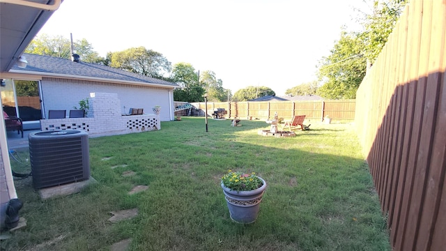 view of yard with central air condition unit