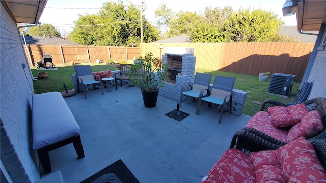 view of patio with central AC unit and an outdoor living space with a fireplace