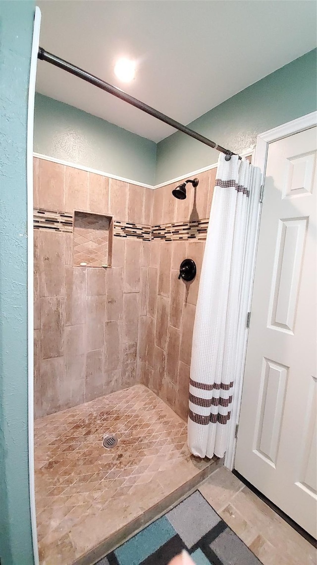 bathroom with a shower with curtain