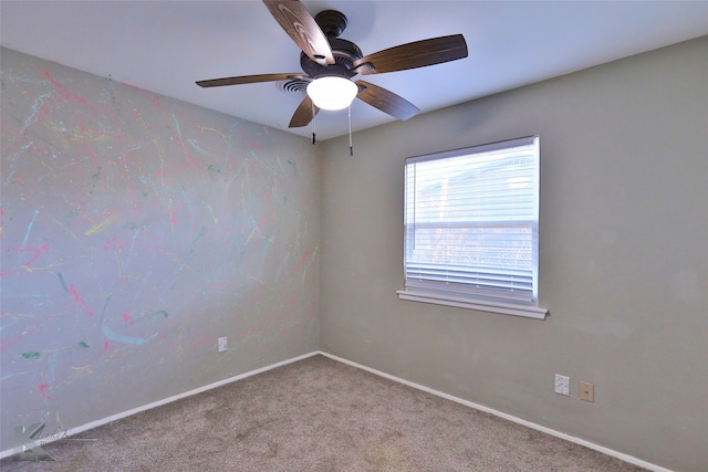 unfurnished room featuring carpet and ceiling fan