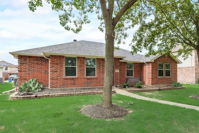 rear view of property featuring a yard