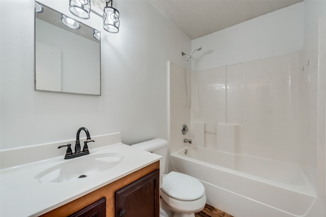 full bathroom with vanity, shower / bath combination, and toilet