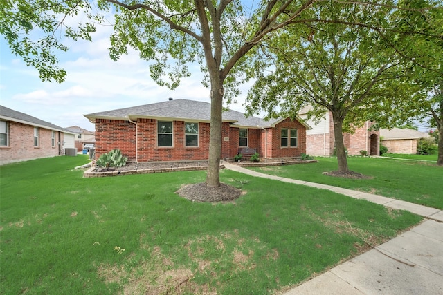 ranch-style house featuring a front yard