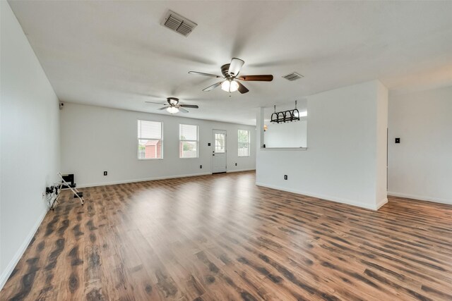 unfurnished living room with hardwood / wood-style floors and ceiling fan