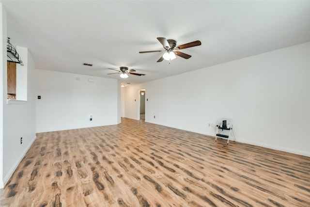 spare room with ceiling fan and light hardwood / wood-style floors