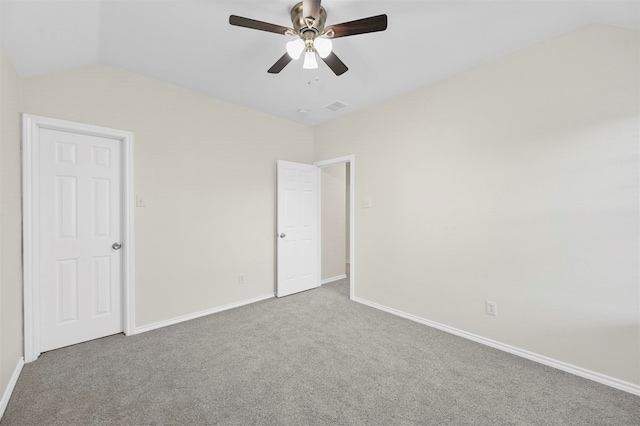 unfurnished bedroom featuring vaulted ceiling, ceiling fan, and carpet floors