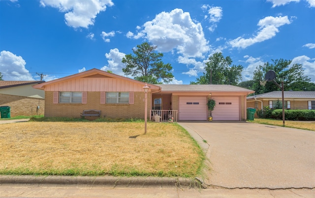 ranch-style house with a garage and a front yard