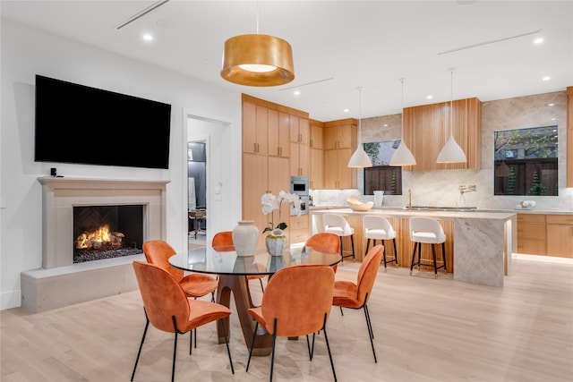 dining room featuring light wood-type flooring